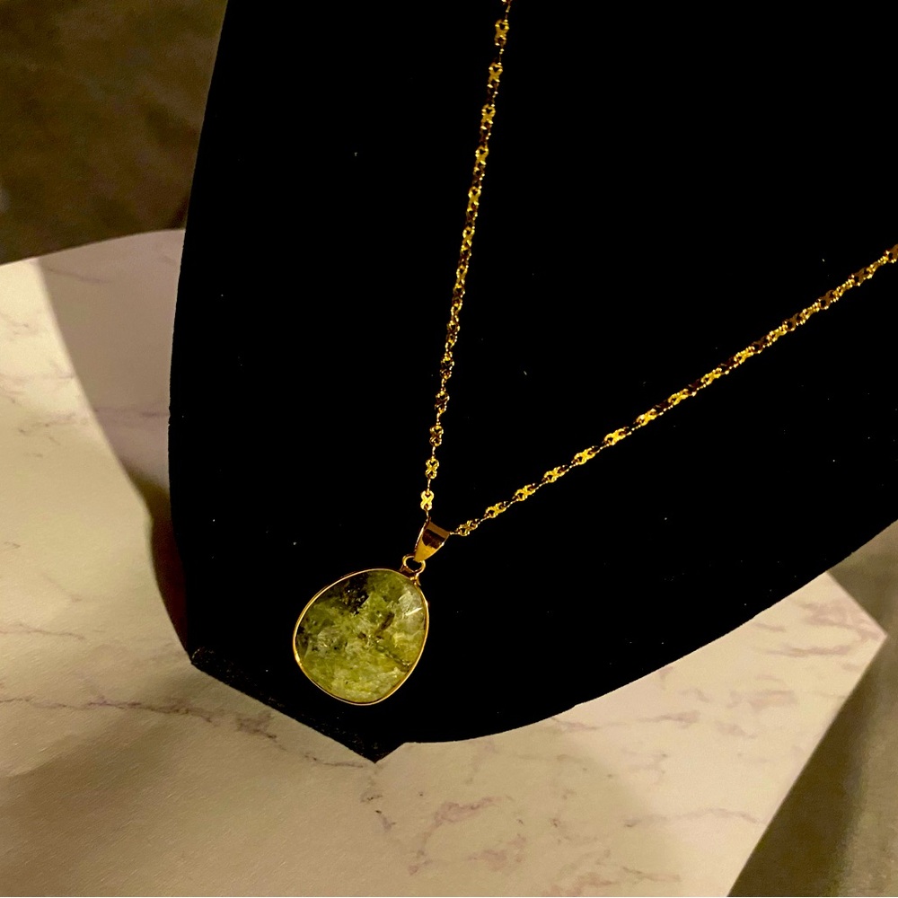 Green emblem stone charm with gold tone chain